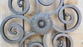 Round wrought iron ornament with curls and flower - OS43