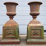 2 Unique antique cast iron garden vases on column