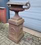 Cast iron garden vase on column with ears