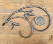 Large cast iron scroll with flower