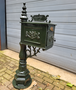 Antique cast iron mailbox on post
