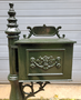 Antique cast iron mailbox on post