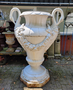 Large antique cast iron vase with swans