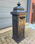 Old cast iron freestanding mailbox