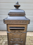 Old cast iron freestanding mailbox